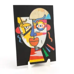 Portrait aux couleurs vives, inspiré par le style cubiste de Picasso. Visage déconstruit avec des formes géométriques et des textures variées.