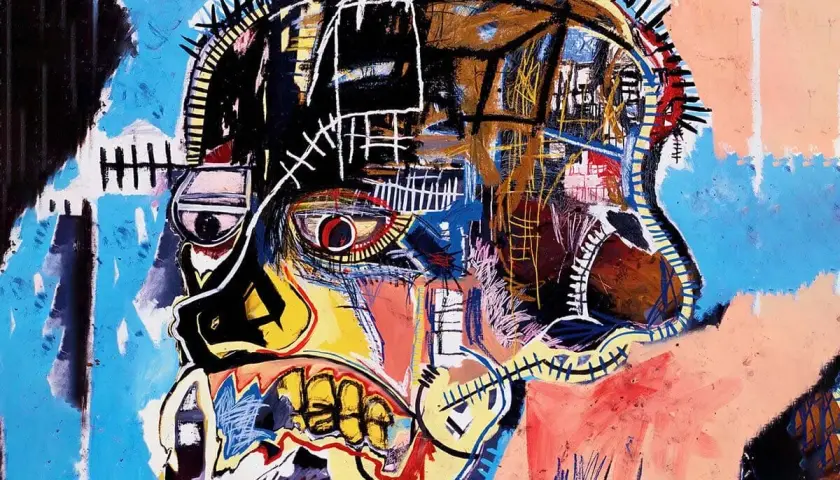 Portrait d'un crâne aux couleurs vives, une des oeuvres majeur de Basquiat, avec un œil rouge intense et une bouche béante.