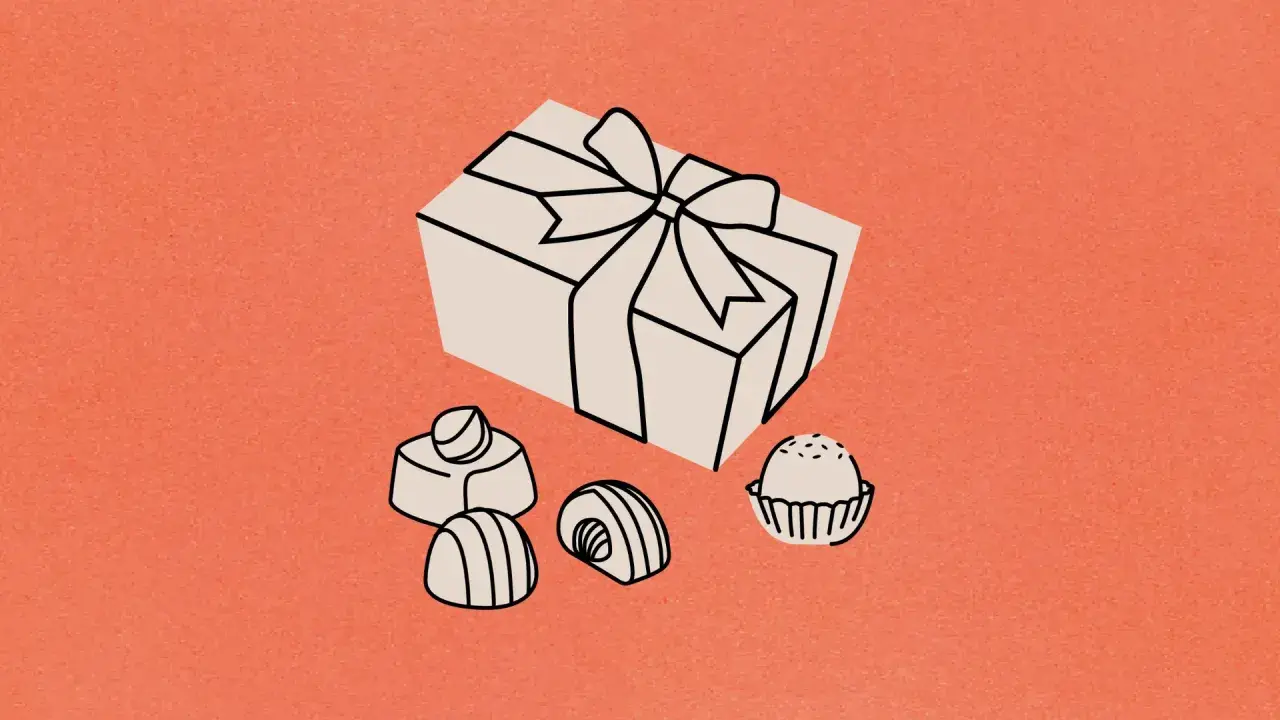 Un cadeau emballé et des chocolats, une scène un peu cucul la praline pour un moment gourmand.