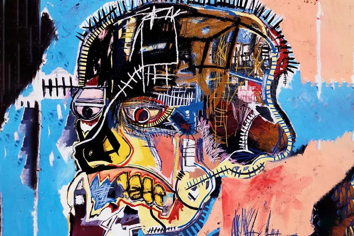 Portrait d'un crâne aux couleurs vives, une des oeuvres majeur de Basquiat, avec un œil rouge intense et une bouche béante.