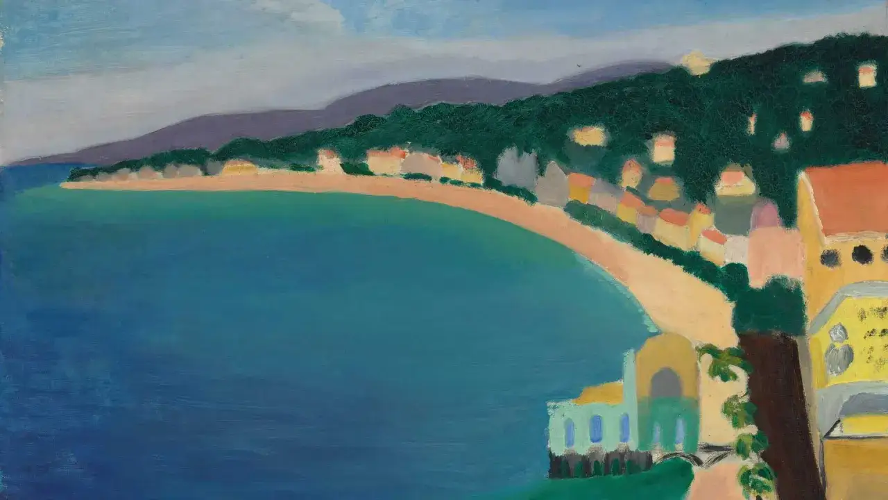 Vue d'une baie aux couleurs vives, avec des maisons colorées sur la colline. Un bel aplat de couleur exemple de la côte.